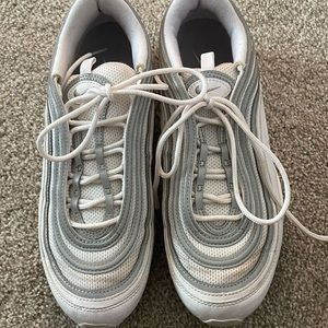 White Nike Air Max gym shoes.